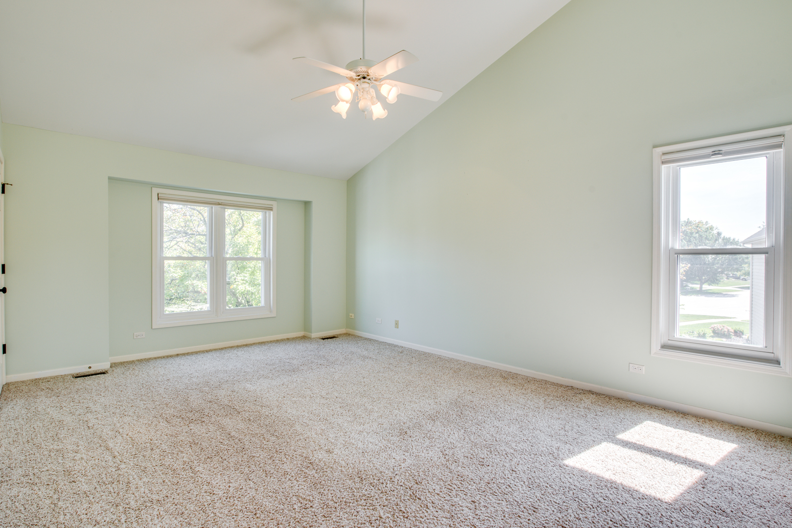 3631 Falkner Drive Naperville, IL 60564 - Photo 30 of 45 an empty room with chandelier fan and windows