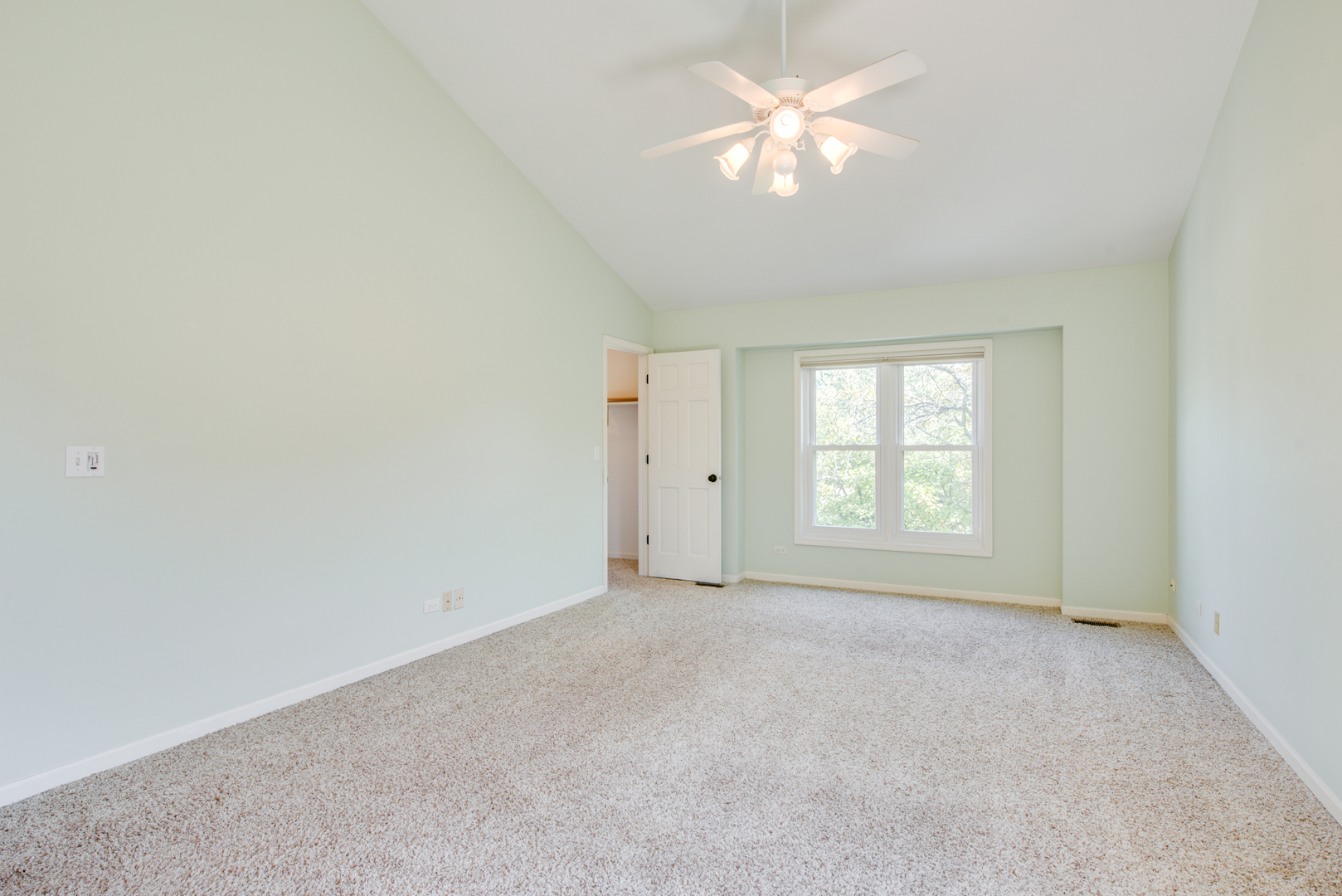 3631 Falkner Drive Naperville, IL 60564 - Photo 31 of 45 an empty room with chandelier fan and windows