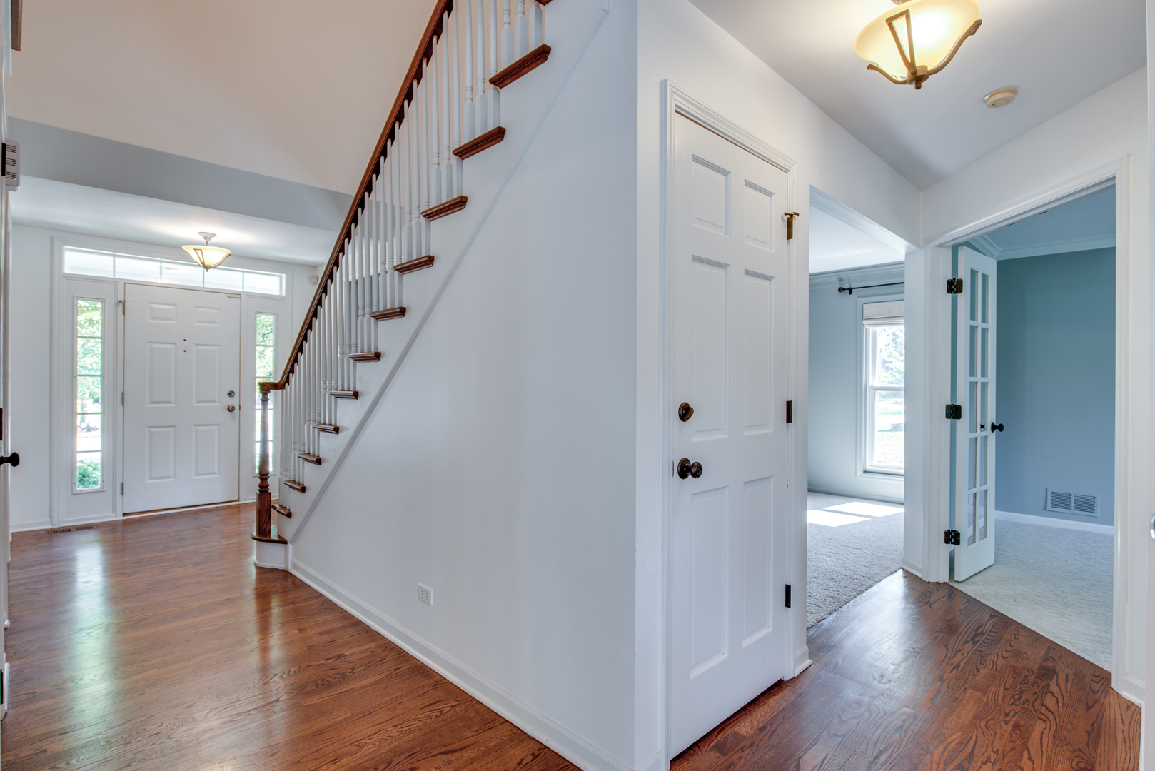 3631 Falkner Drive Naperville, IL 60564 - Photo 4 of 45 a view of a hallway with wooden floor and entryway