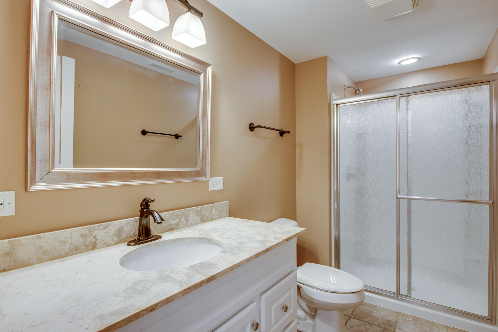 3631 Falkner Drive Naperville, IL 60564 - Photo 41 of 45 a bathroom with a granite countertop sink toilet and a mirror