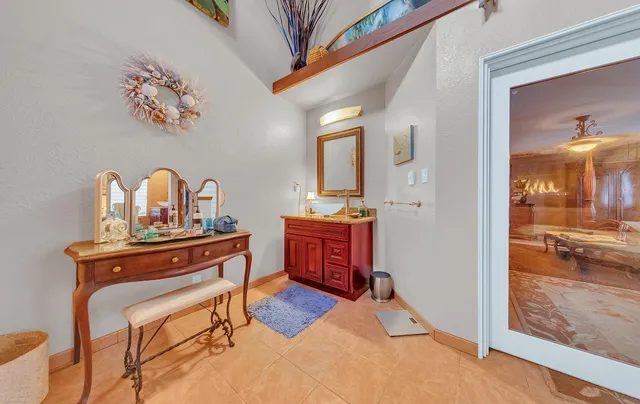 a view of living room with furniture and wooden floor