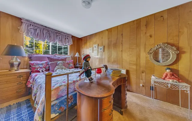 a living room with furniture a window and a chandelier