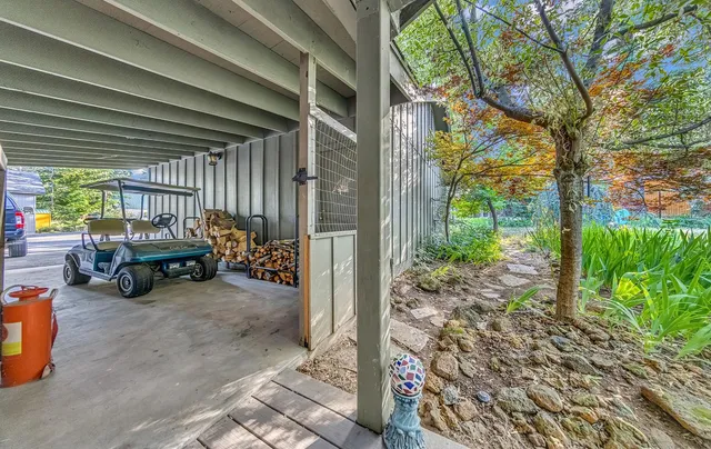 a view of a garage with parked cars