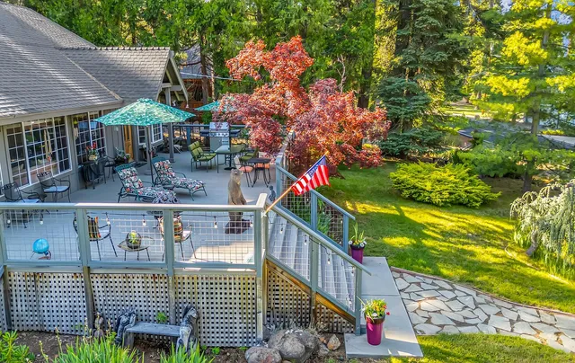 a balcony with lots of plants and flowers