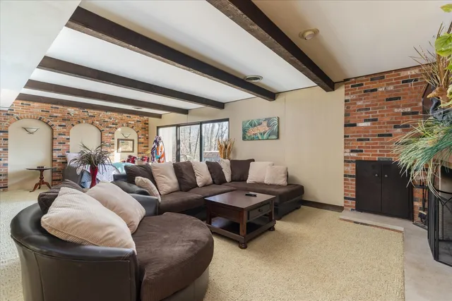 a bedroom with a bed and glass door