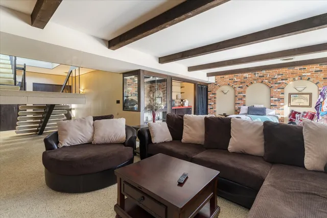 a view of a patio with table and chairs