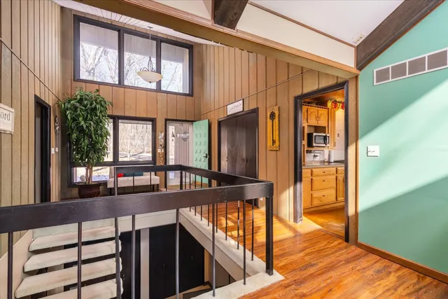 a view of a patio with couches table and chairs and potted plants