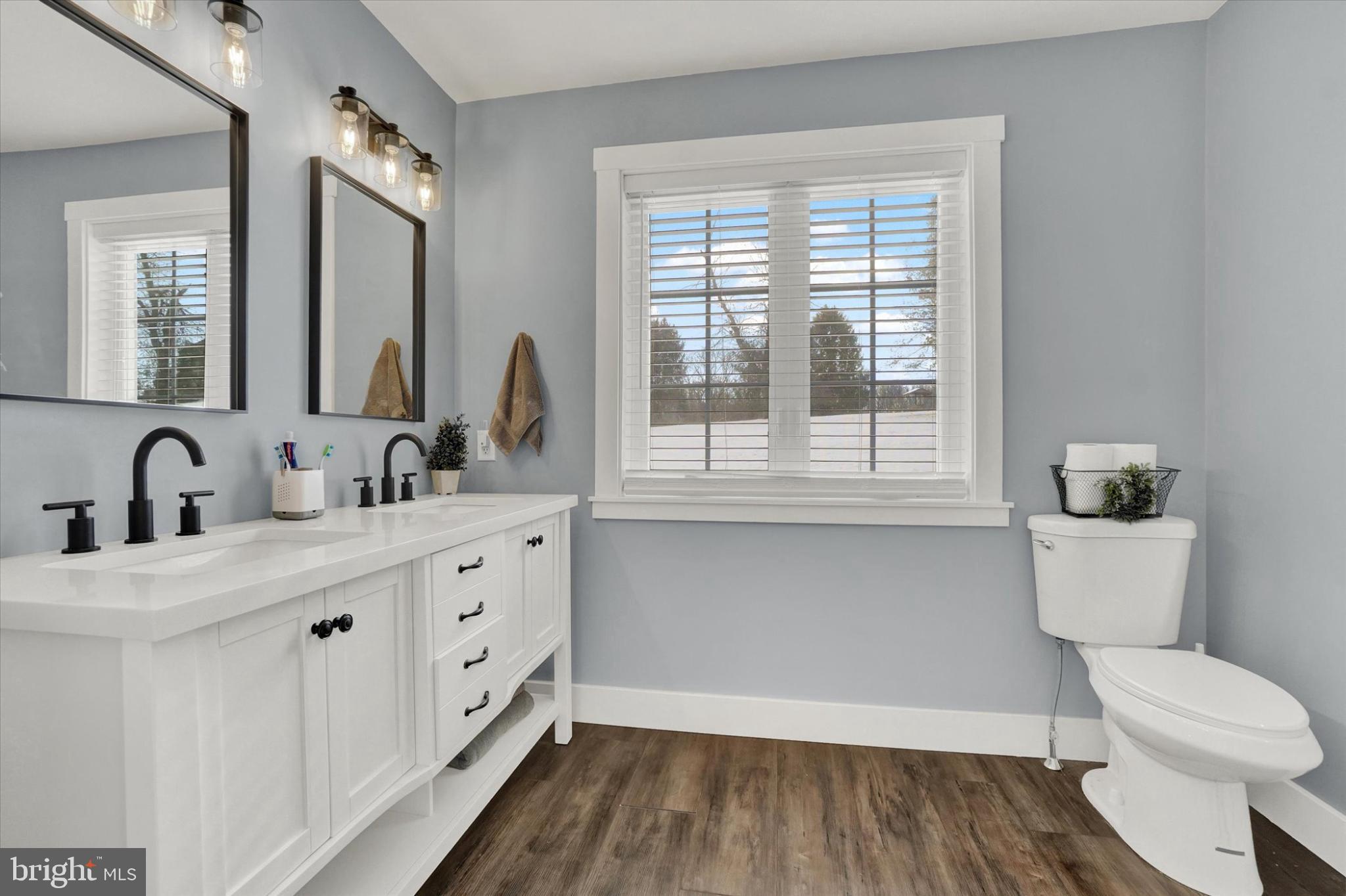 1048 Keller Road York, PA 17406 - Photo 20 of 28 a spacious bathroom with 2 sink toilet and a mirror