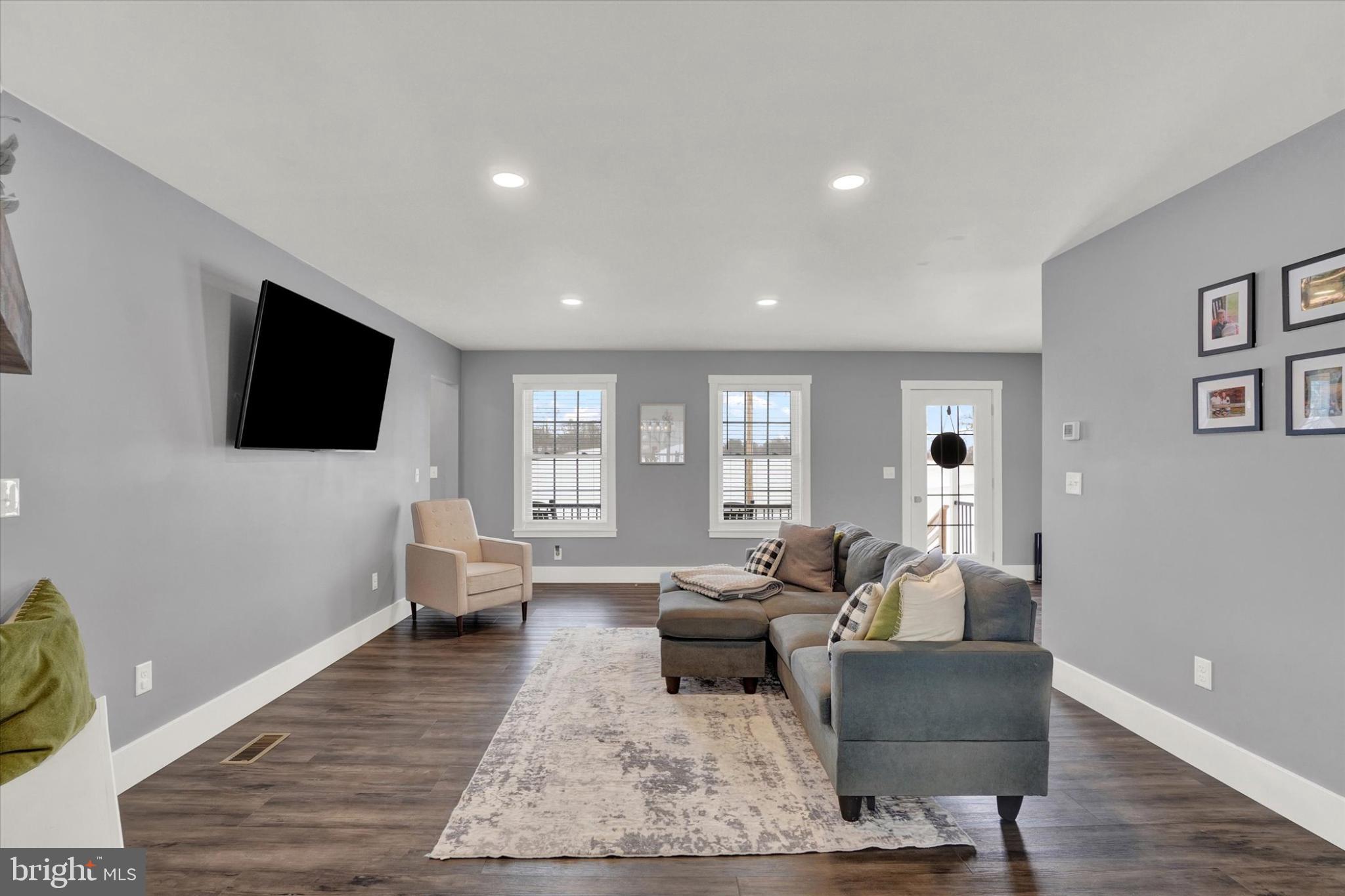 1048 Keller Road York, PA 17406 - Photo 6 of 28 a living room with furniture and a flat screen tv