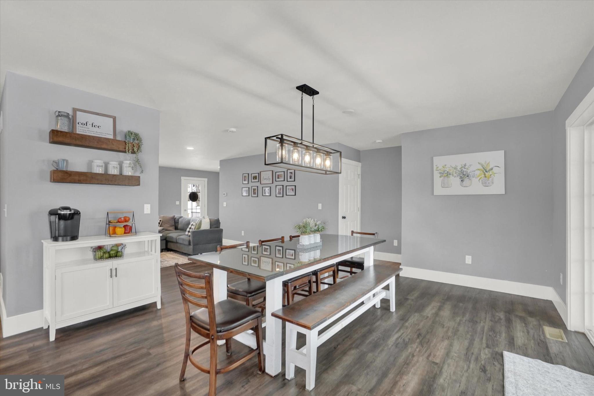 1048 Keller Road York, PA 17406 - Photo 8 of 28 a room with a table chairs and wooden floor