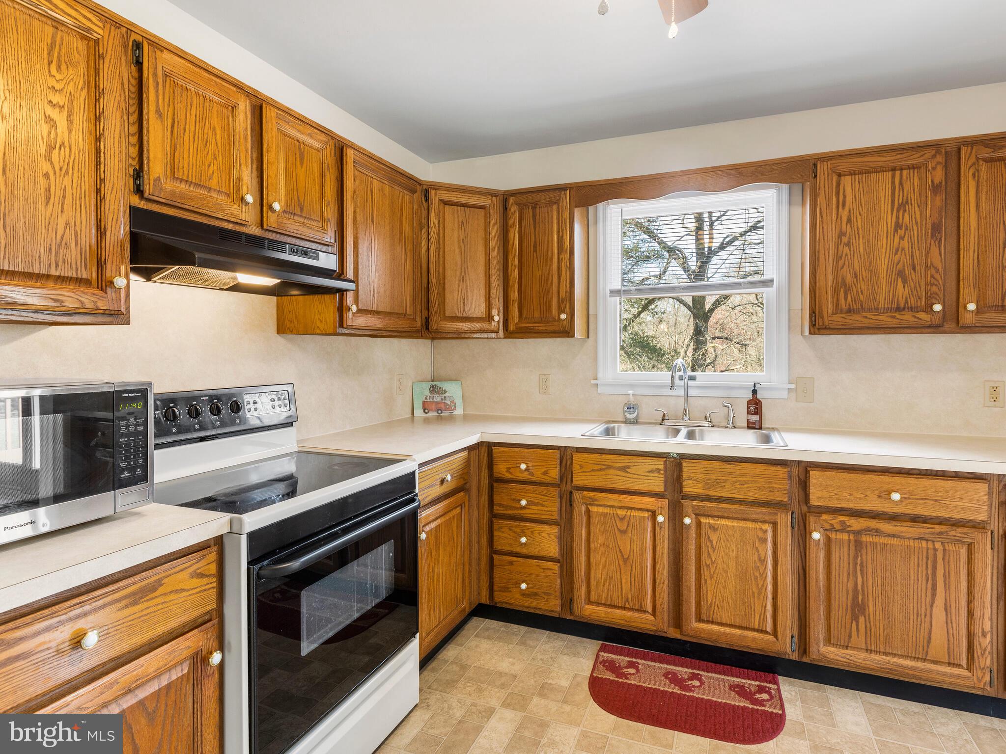412 Saylors Mill Road Spring City, PA 19475 - Photo 13 of 55 Beautiful wood cabinetry and a view of the yard!
