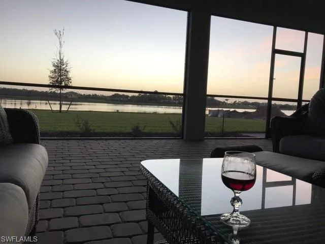 a balcony with table and chairs