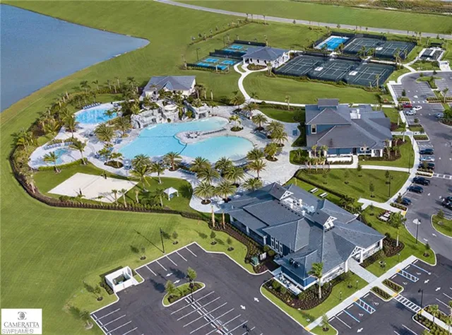 an aerial view of a house with a swimming pool yard and outdoor seating