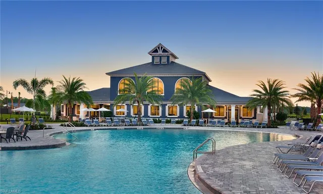 a view of a lake with boats and palm trees