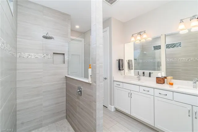 a bedroom with a bed table and window