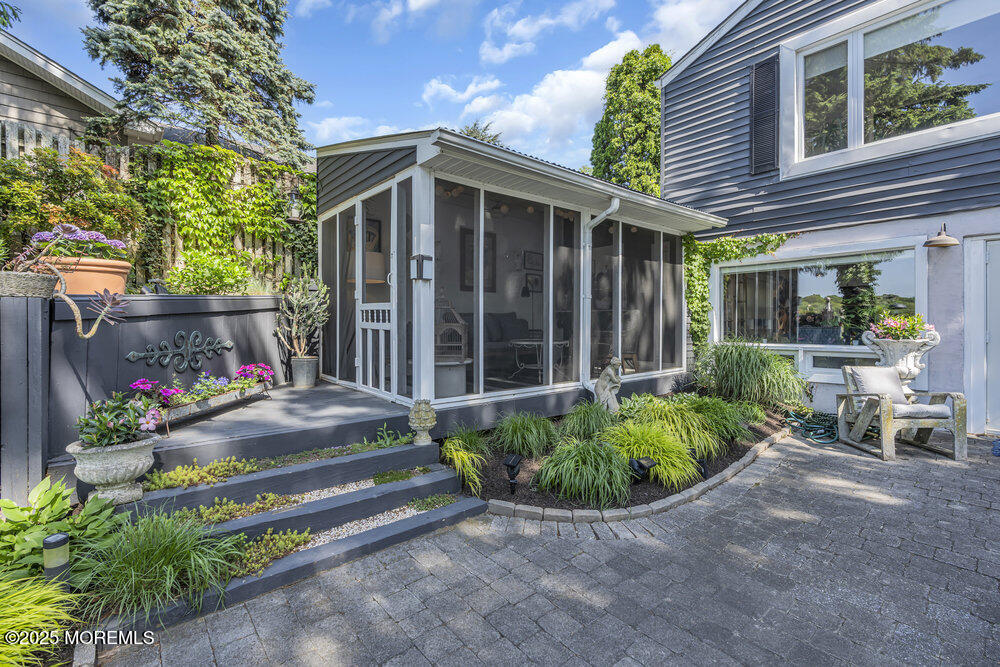 638 South Riverside Drive Neptune Township, NJ 07753 - Photo 12 of 41 a view of a house with a yard and potted plants