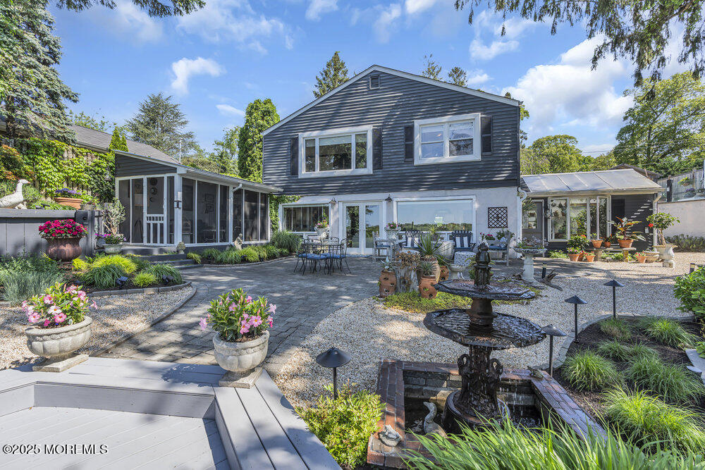 638 South Riverside Drive Neptune Township, NJ 07753 - Photo 13 of 41 a front view of a house with garden and sitting area