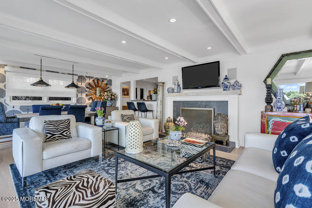 638 South Riverside Drive Neptune Township, NJ 07753 - Photo 16 of 41 a living room with furniture and a fireplace
