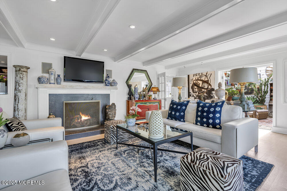 638 South Riverside Drive Neptune Township, NJ 07753 - Photo 17 of 41 a living room with furniture and a fireplace