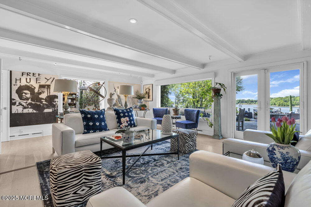 638 South Riverside Drive Neptune Township, NJ 07753 - Photo 19 of 41 a living room with furniture and a large window