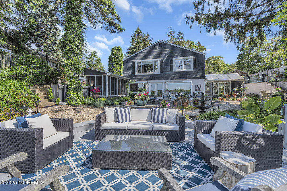 638 South Riverside Drive Neptune Township, NJ 07753 - Photo 3 of 41 a view of a patio with couches table and chairs and potted plants