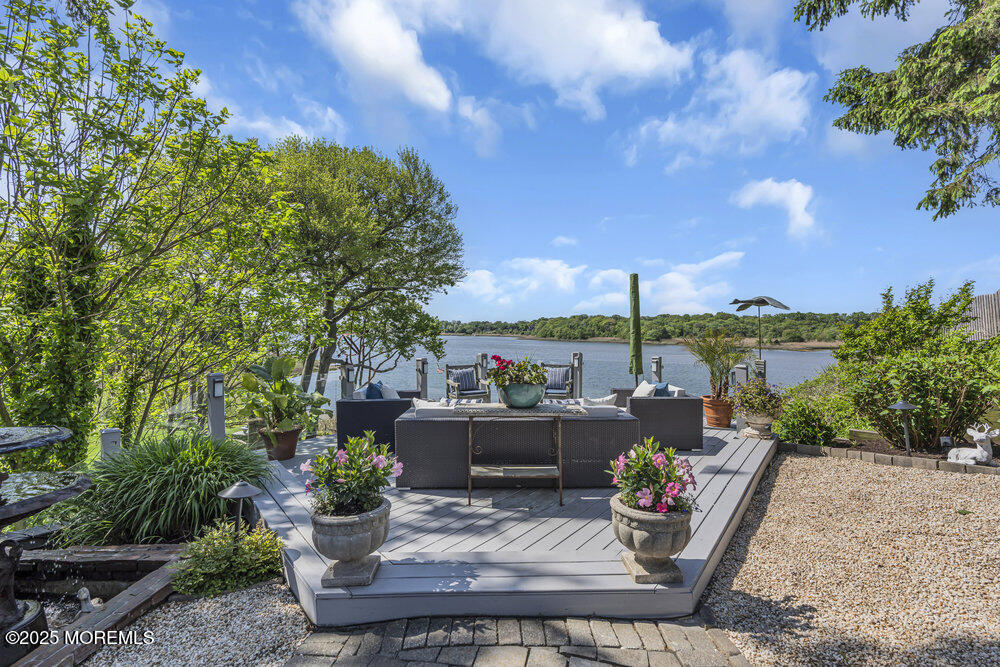 638 South Riverside Drive Neptune Township, NJ 07753 - Photo 4 of 41 a view of a patio with couches table and chairs and potted plants