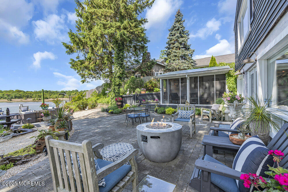 638 South Riverside Drive Neptune Township, NJ 07753 - Photo 9 of 41 a view of a patio with chairs and potted plants