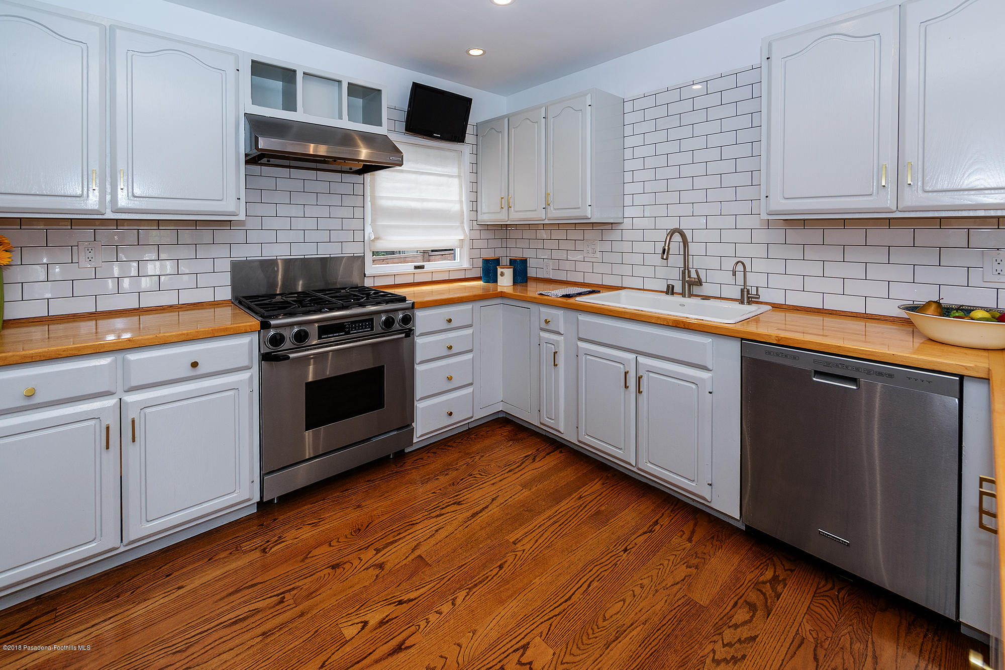 1280 Afton Street Pasadena, CA 91103 - Photo 12 of 39 a kitchen with stainless steel appliances granite countertop a sink stove and cabinets