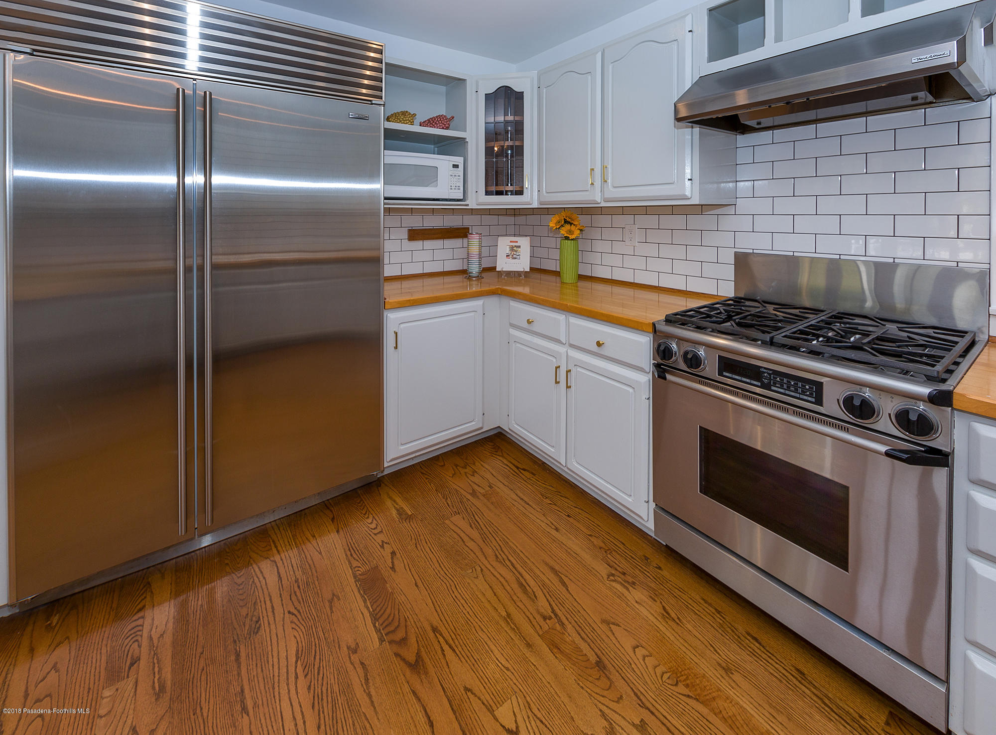 1280 Afton Street Pasadena, CA 91103 - Photo 13 of 39 a kitchen with granite countertop stainless steel appliances and wooden cabinets