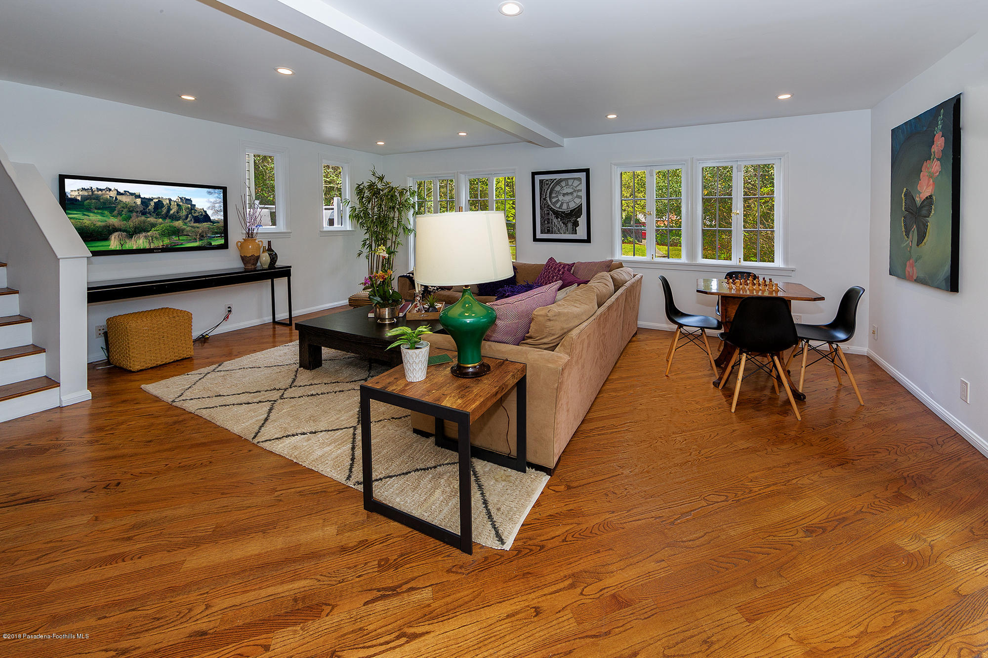 1280 Afton Street Pasadena, CA 91103 - Photo 17 of 39 a living room with furniture a window and a flat screen tv