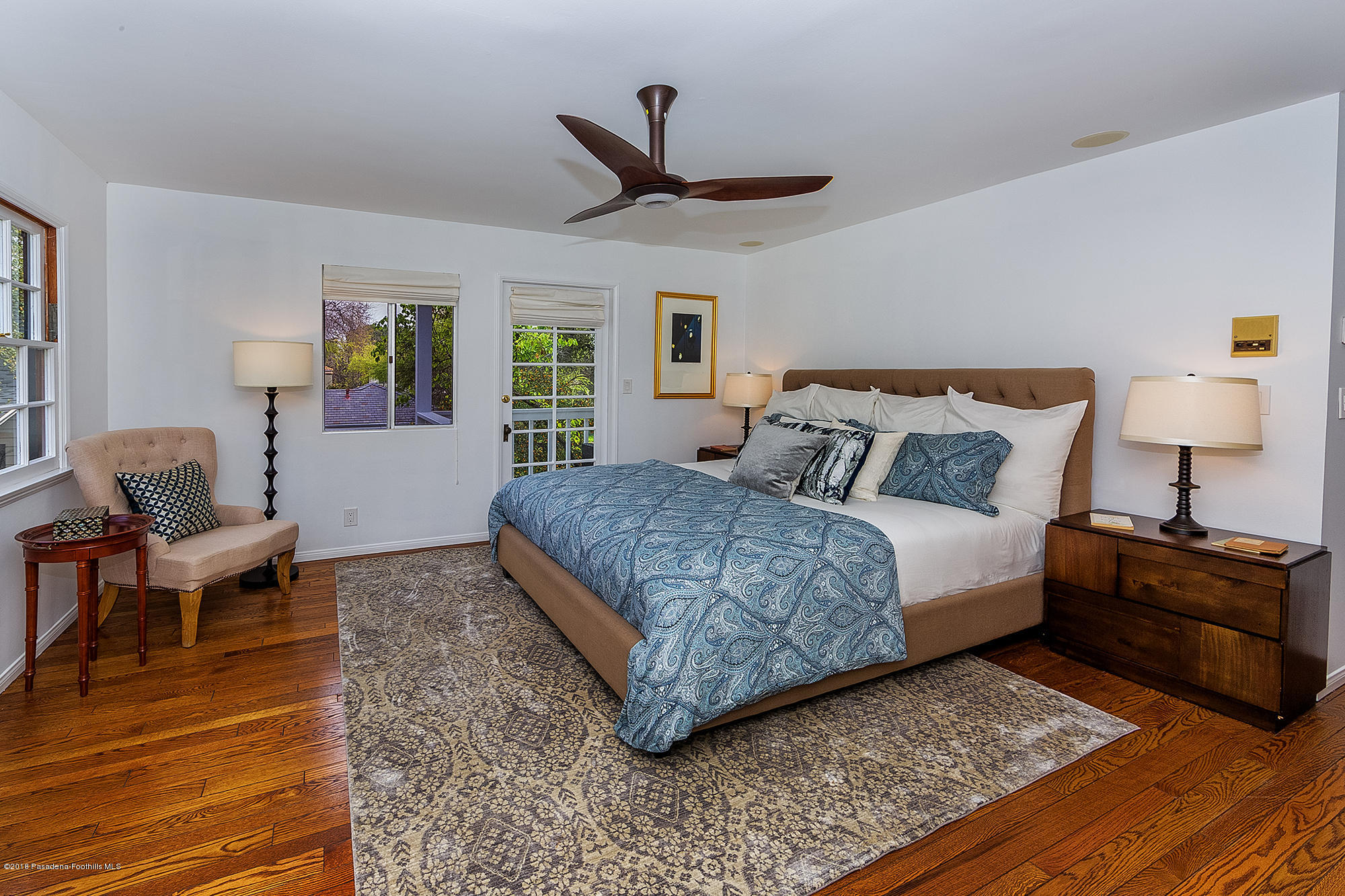 1280 Afton Street Pasadena, CA 91103 - Photo 22 of 39 a bedroom with a bed wooden floor and a ceiling fan