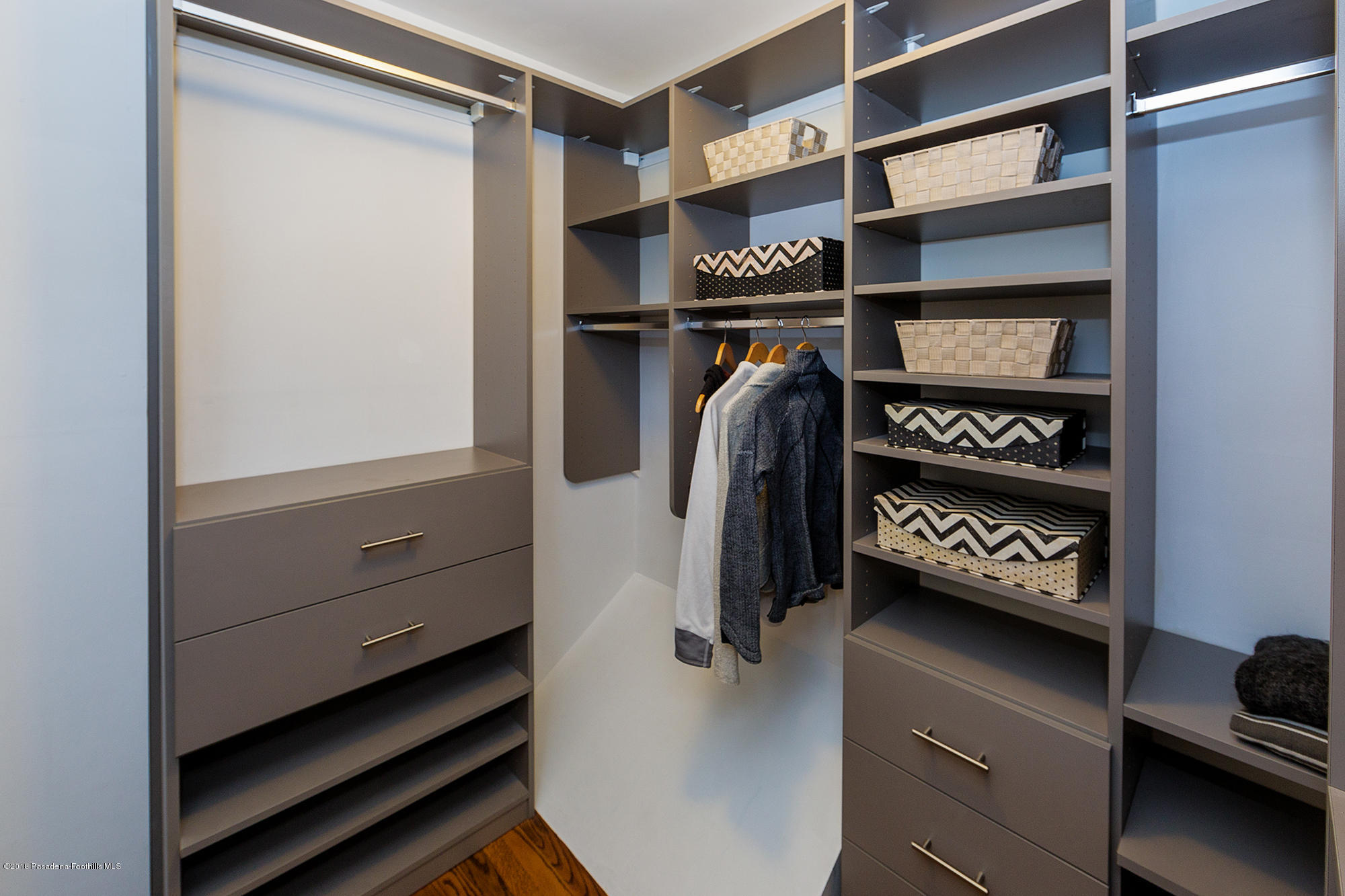 1280 Afton Street Pasadena, CA 91103 - Photo 23 of 39 a view of walk in closet with clothes and shoes