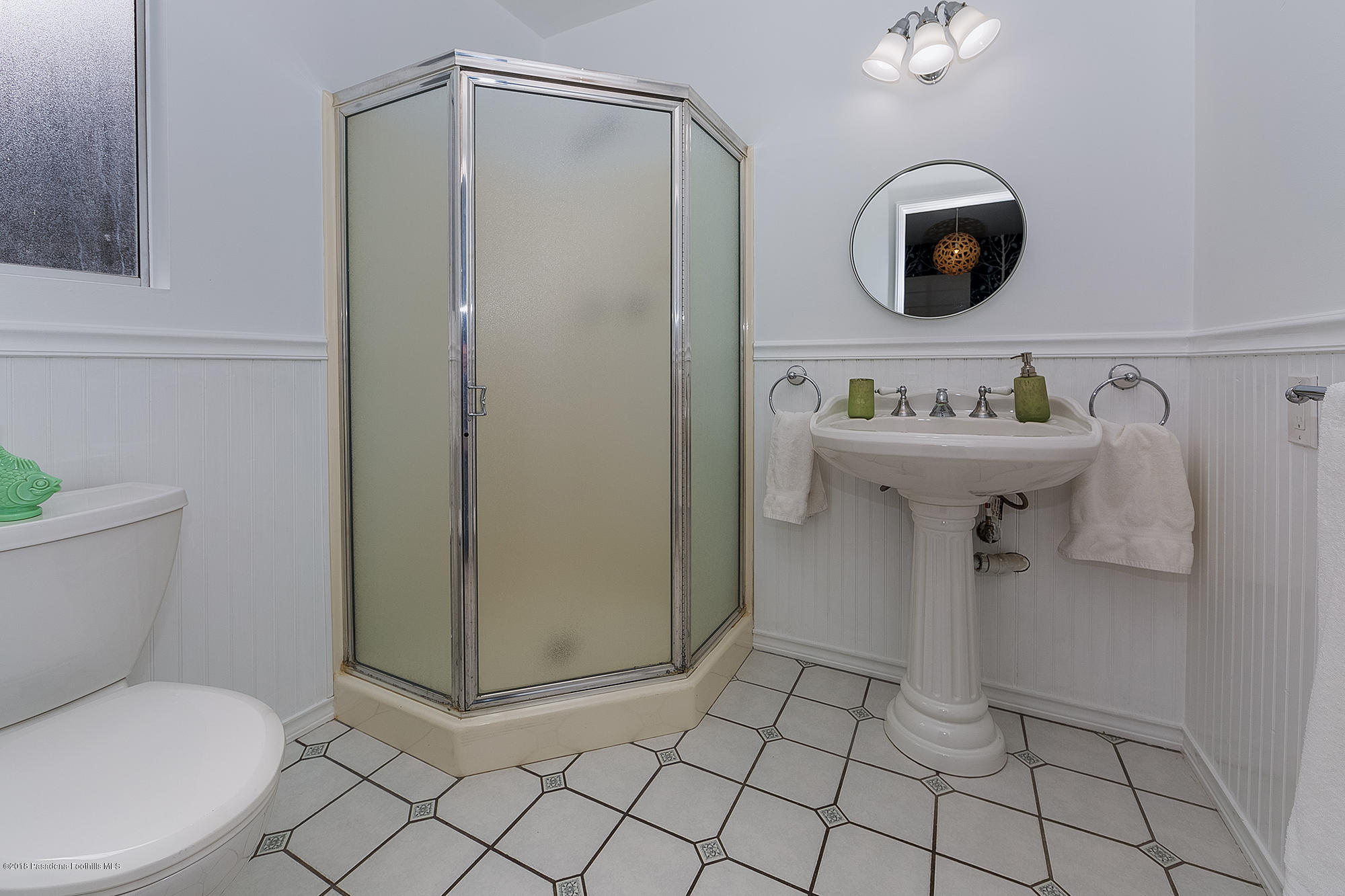 1280 Afton Street Pasadena, CA 91103 - Photo 26 of 39 a bathroom with a sink a toilet and a mirror