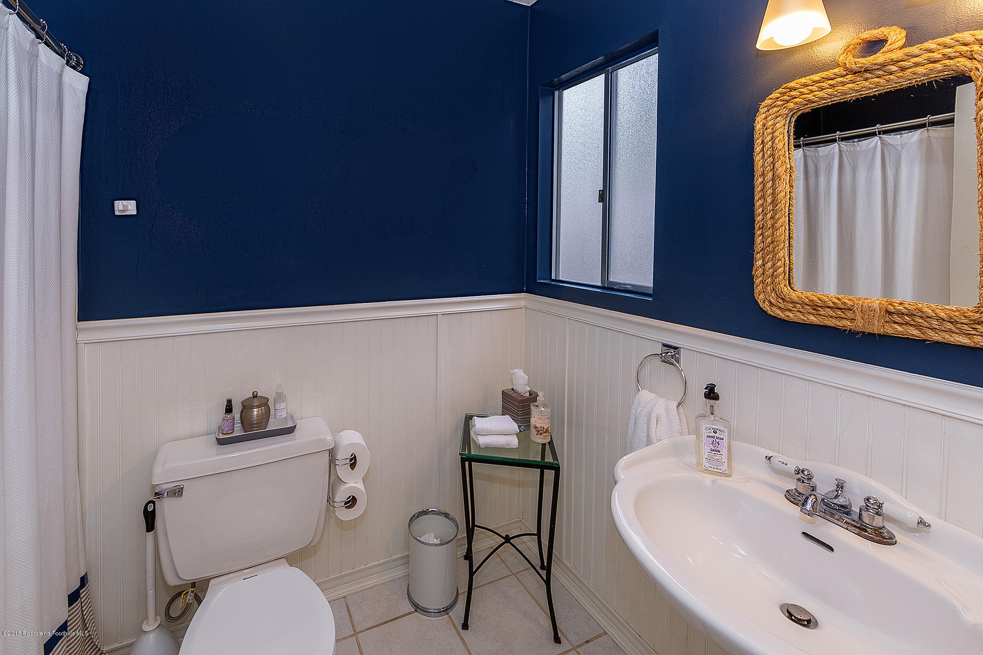 1280 Afton Street Pasadena, CA 91103 - Photo 35 of 39 a bathroom with a sink mirror and toilet
