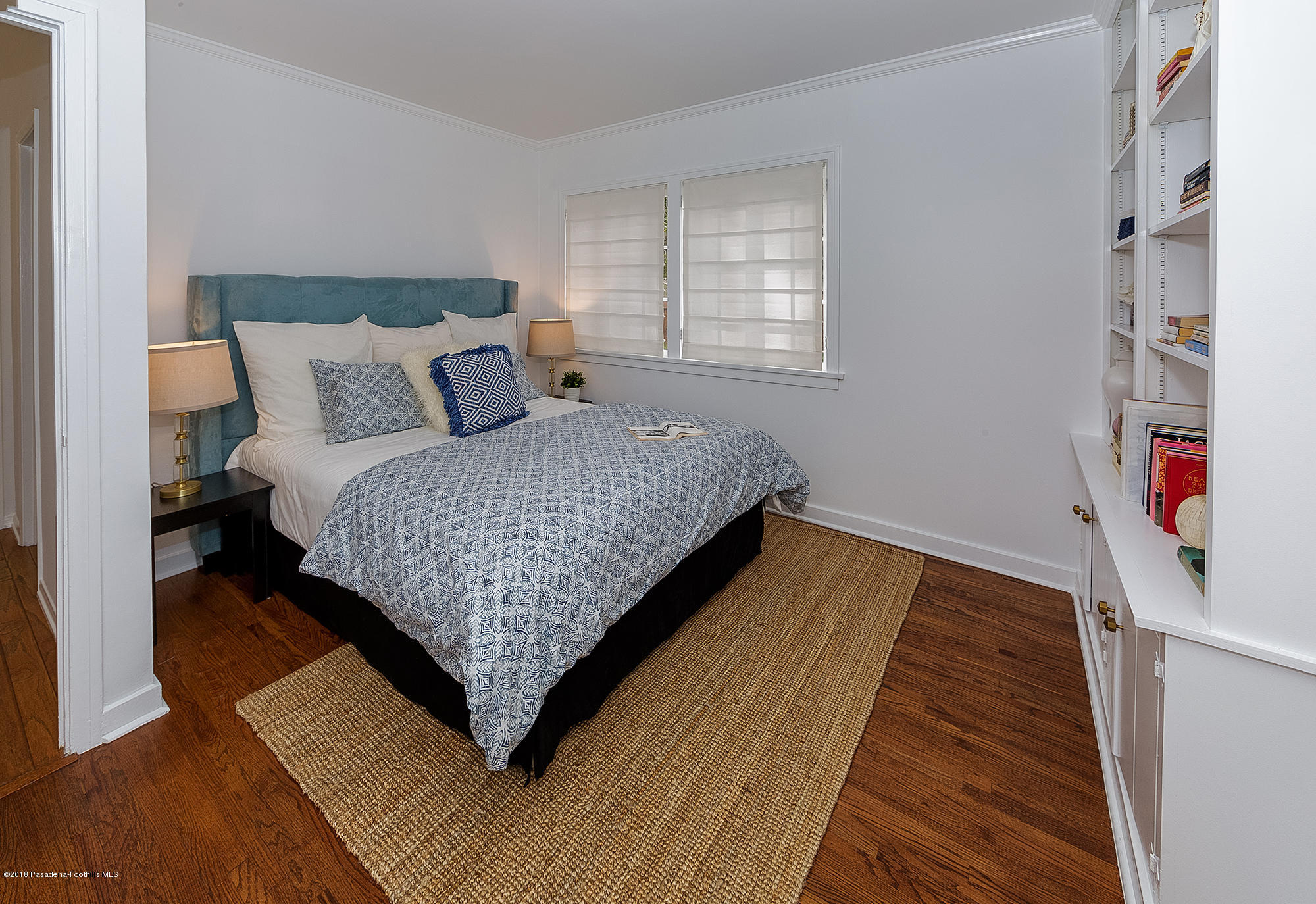 1280 Afton Street Pasadena, CA 91103 - Photo 9 of 39 a bed sitting in a bedroom next to a window