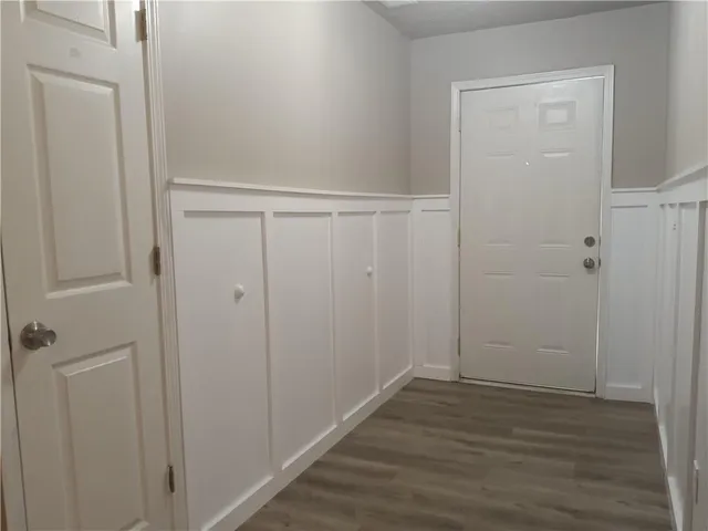 a view of closet area with wooden floor