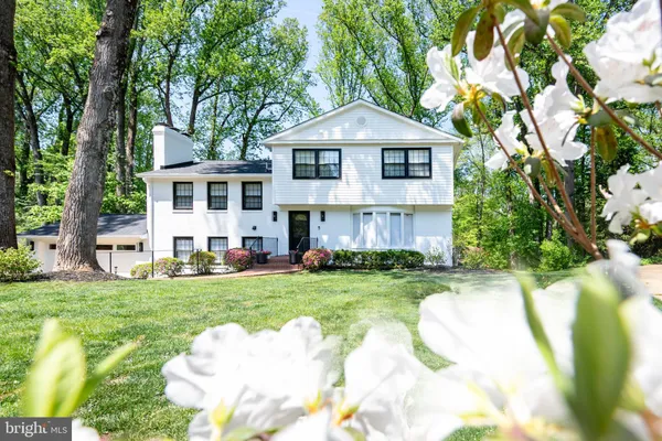 a front view of a house with a yard and porch