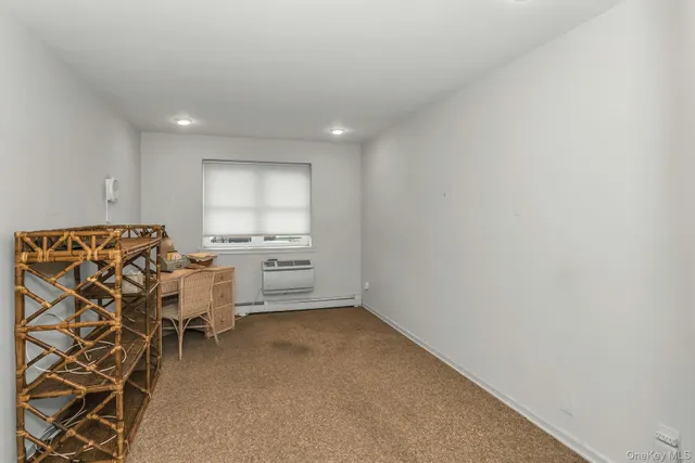 a view of a livingroom with chairs