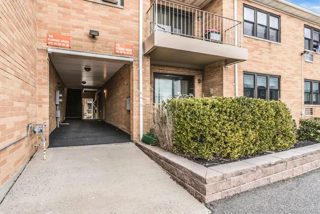 front view of a house with a large window
