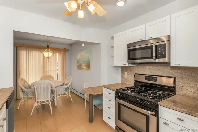 a kitchen with a stove and a microwave
