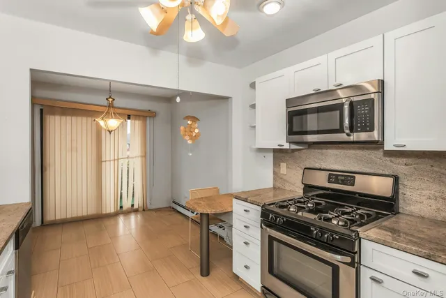 a kitchen with a stove and a microwave