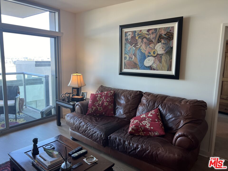 13700 Marina Pointe Drive, Unit 722 Marina del Rey, CA 90292 - Photo 13 of 52 a living room with furniture and a large window