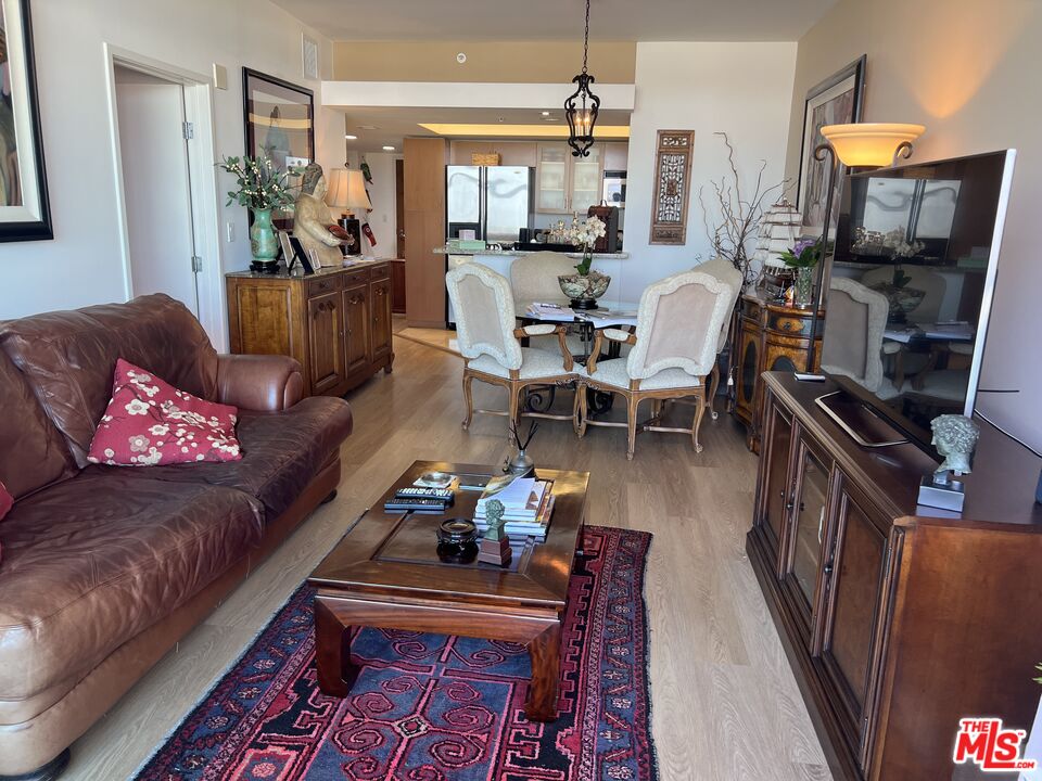13700 Marina Pointe Drive, Unit 722 Marina del Rey, CA 90292 - Photo 16 of 52 a living room with furniture and a flat screen tv
