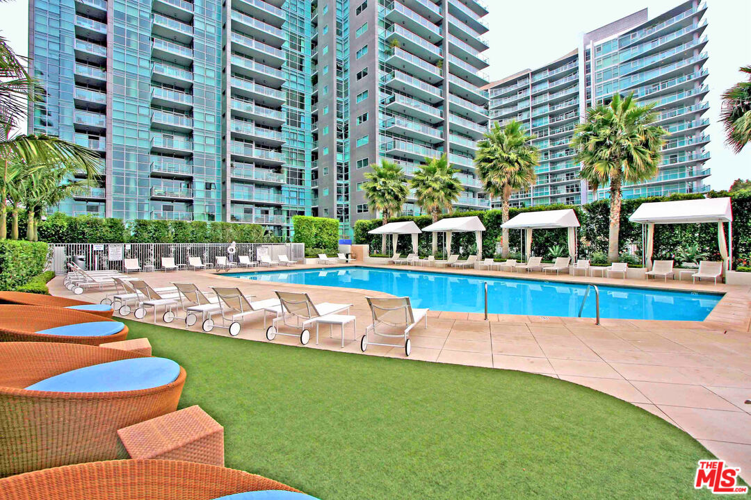 13700 Marina Pointe Drive, Unit 722 Marina del Rey, CA 90292 - Photo 32 of 52 a view of a swimming pool with chairs