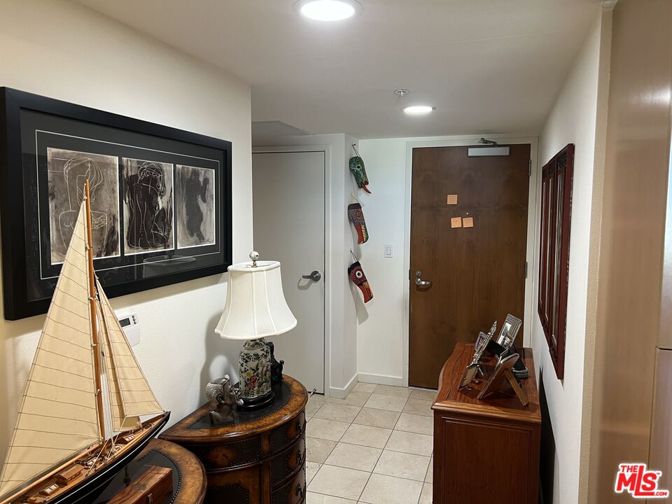 13700 Marina Pointe Drive, Unit 722 Marina del Rey, CA 90292 - Photo 5 of 52 a room with furniture and wooden floor