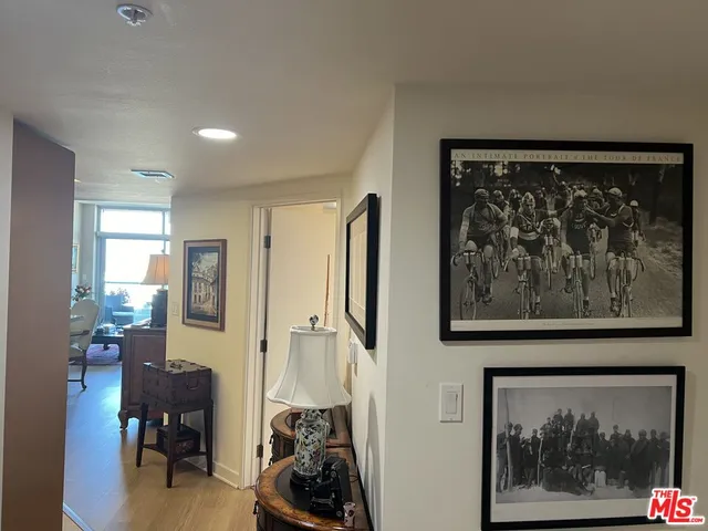 a view of a hallway with a painting on the wall