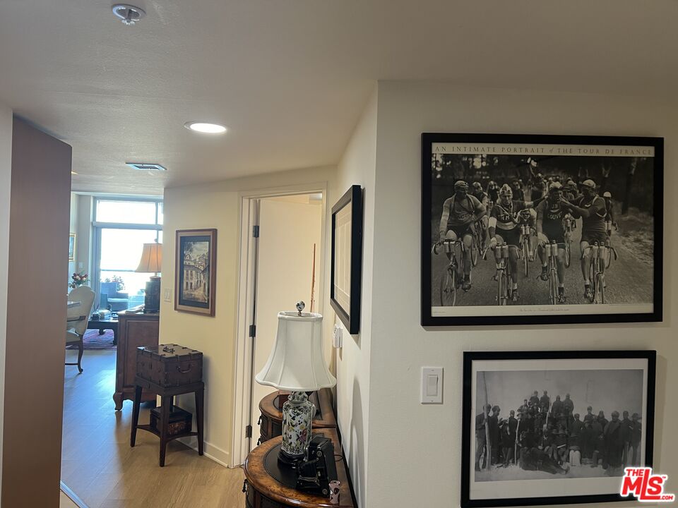 13700 Marina Pointe Drive, Unit 722 Marina del Rey, CA 90292 - Photo 6 of 52 a view of a hallway with a painting on the wall