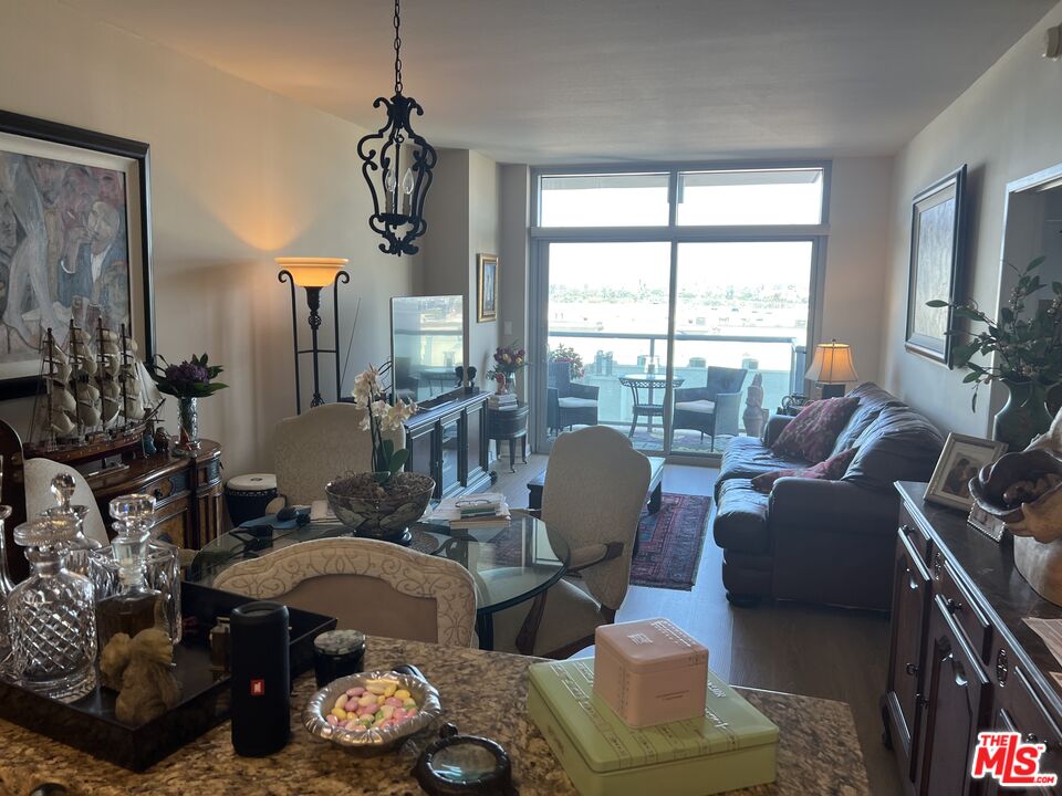 13700 Marina Pointe Drive, Unit 722 Marina del Rey, CA 90292 - Photo 9 of 52 a living room with furniture and a window