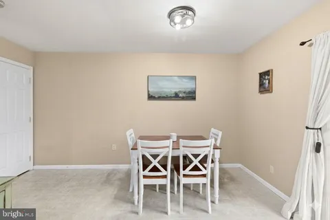 a view of a livingroom with furniture and a window