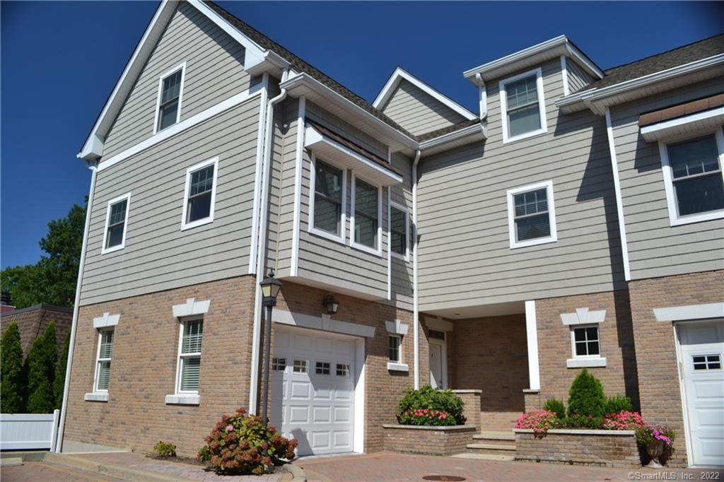 88 Maple Tree Avenue, Unit F Stamford, CT 06906 - Photo 1 of 1 a front view of a house with street